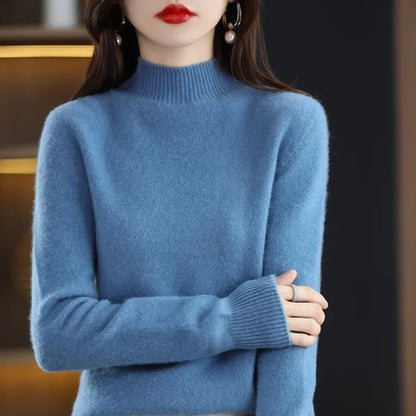 Half high collar women sweater medium weight knitwear, full sleeve slim fit top shown tucked into tailored trousers
