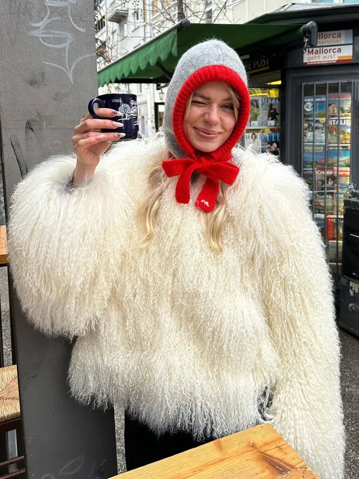 White faux fur jacket from front angle, open-front silhouette and plush finish, styled for an elevated day look
