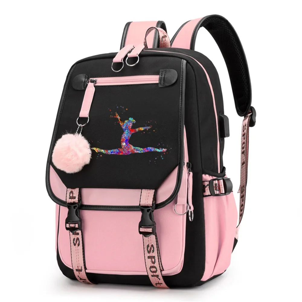 Pink and black backpack in design 1D-35-9 with a colorful gymnast print, buckle straps and pink pendant, shown against white.