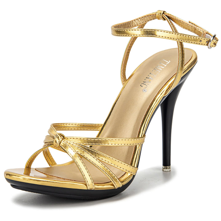 Gold high-heeled sandal on a white background