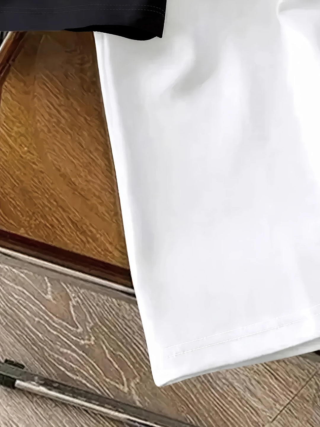 Original detail photo of the white body and hem stitching