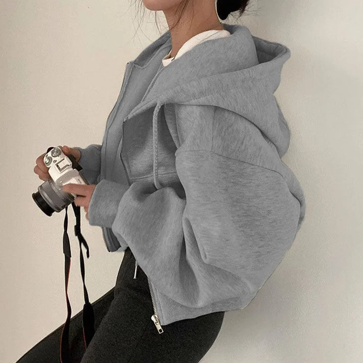 Light grey cropped full zip hoodie shown on a model, with original details, retained as an original supplier reference image.
