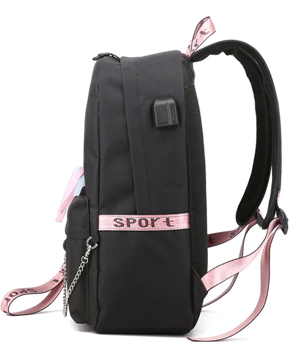 Side view of the black school backpack, showing its connection port, shoulder strap, pink webbing and silver chain in detail.
