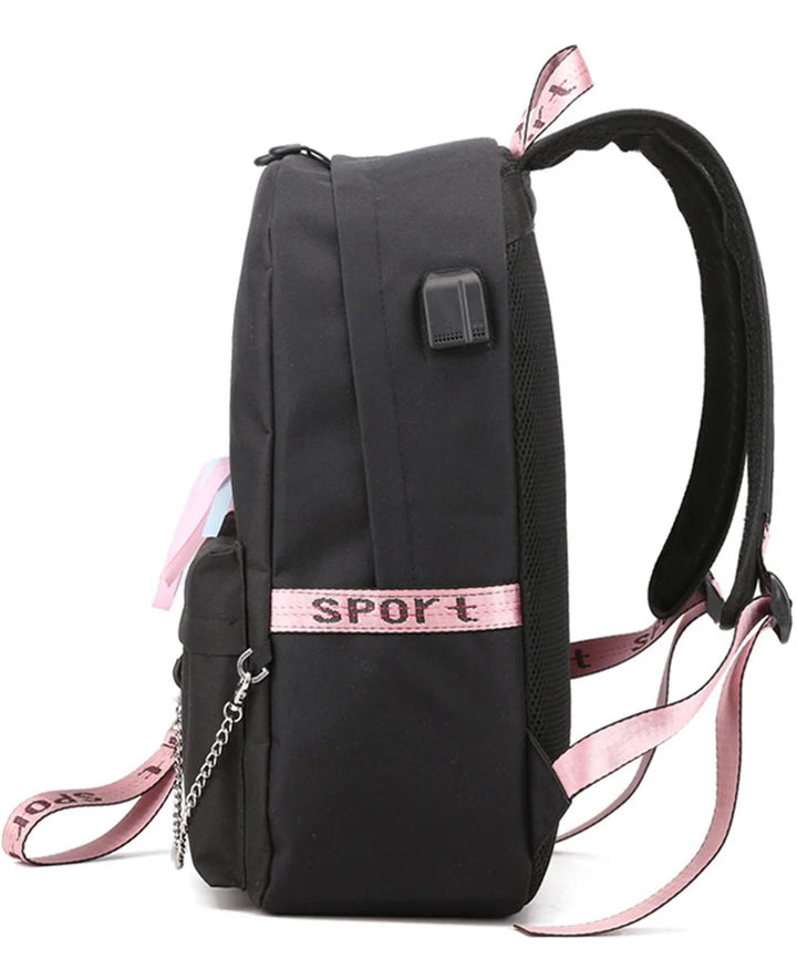Side view of the plain black base bag displaying the external USB port, side pocket, pink trim and adjustable shoulder strap.