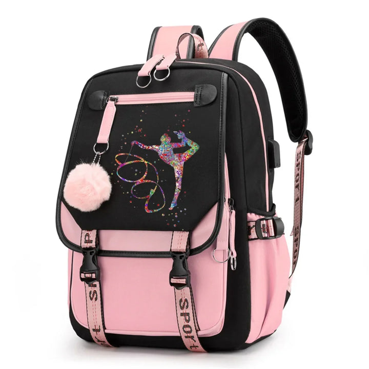Pink and black backpack in design 1D-35-2 with a colorful gymnast print, buckle straps and pink pendant, shown against white.