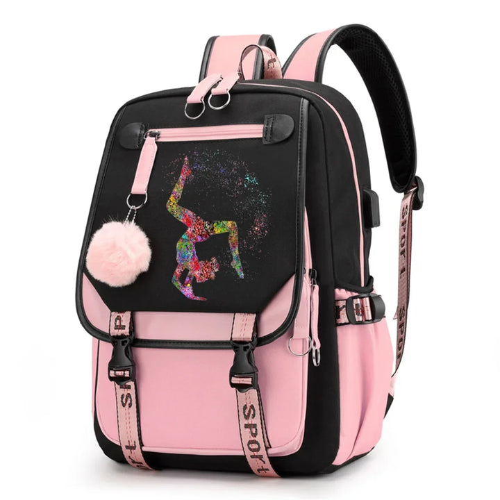 Pink and black backpack in design 1D-35-16 with a colorful gymnast print, buckle straps and pink pendant, shown against white