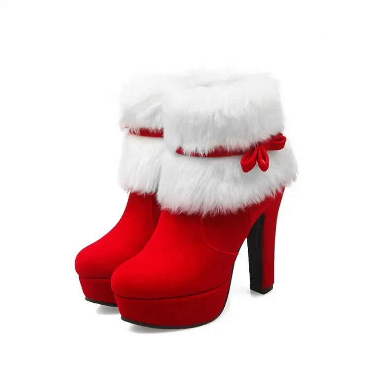 Red platform ankle boots displayed as a pair on white, showing fluffy white cuffs, matching bows, round toes, and tall heels.