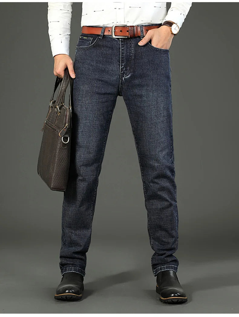 "men's mid rise straight jeans detail shot of waistband and belt loops emphasizing tailored finish"