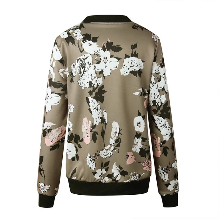 Army Green printed jacket back view on white, showing large white flowers, pink accents and dark ribbed hem in a studio view.