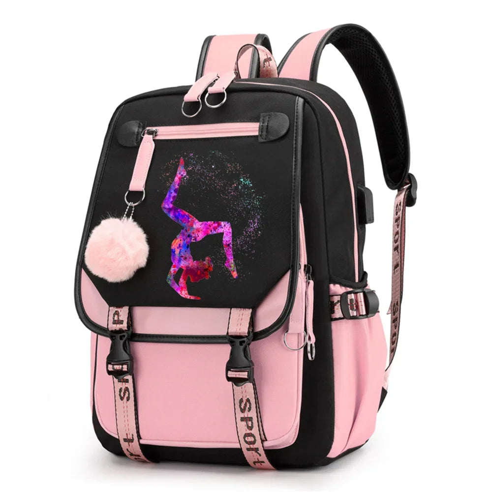 Pink and black backpack in design 1D-35-17 with a colorful gymnast print, buckle straps and pink pendant, shown against white
