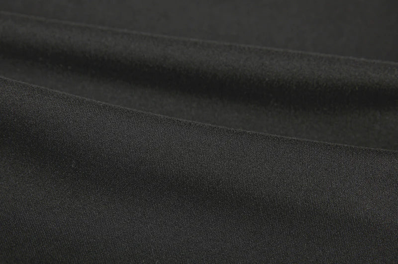 Maxi dress product image showing the sleeveless shape, long hemline and open side sections connected by multiple straps view.