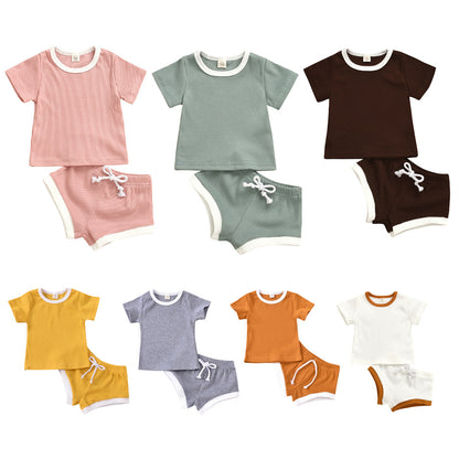 Side view of the breathable cotton fabric in our infant two-piece set design.