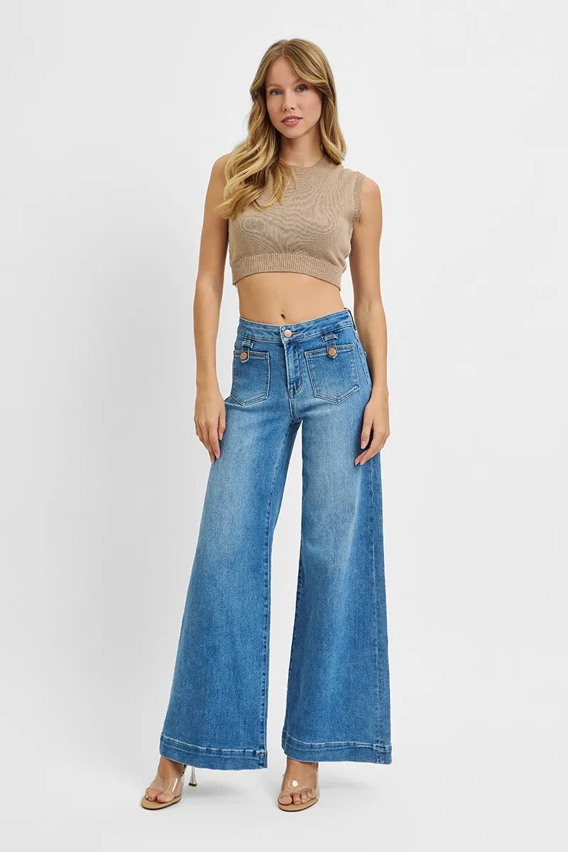 “Slight stretch denim hugs curves, ensuring comfort in plus-size wide-leg silhouette.”

