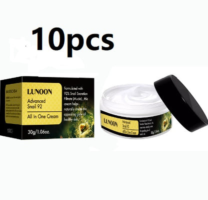 Snail Cream jar glowing on smooth skin, fading wrinkles with every use.