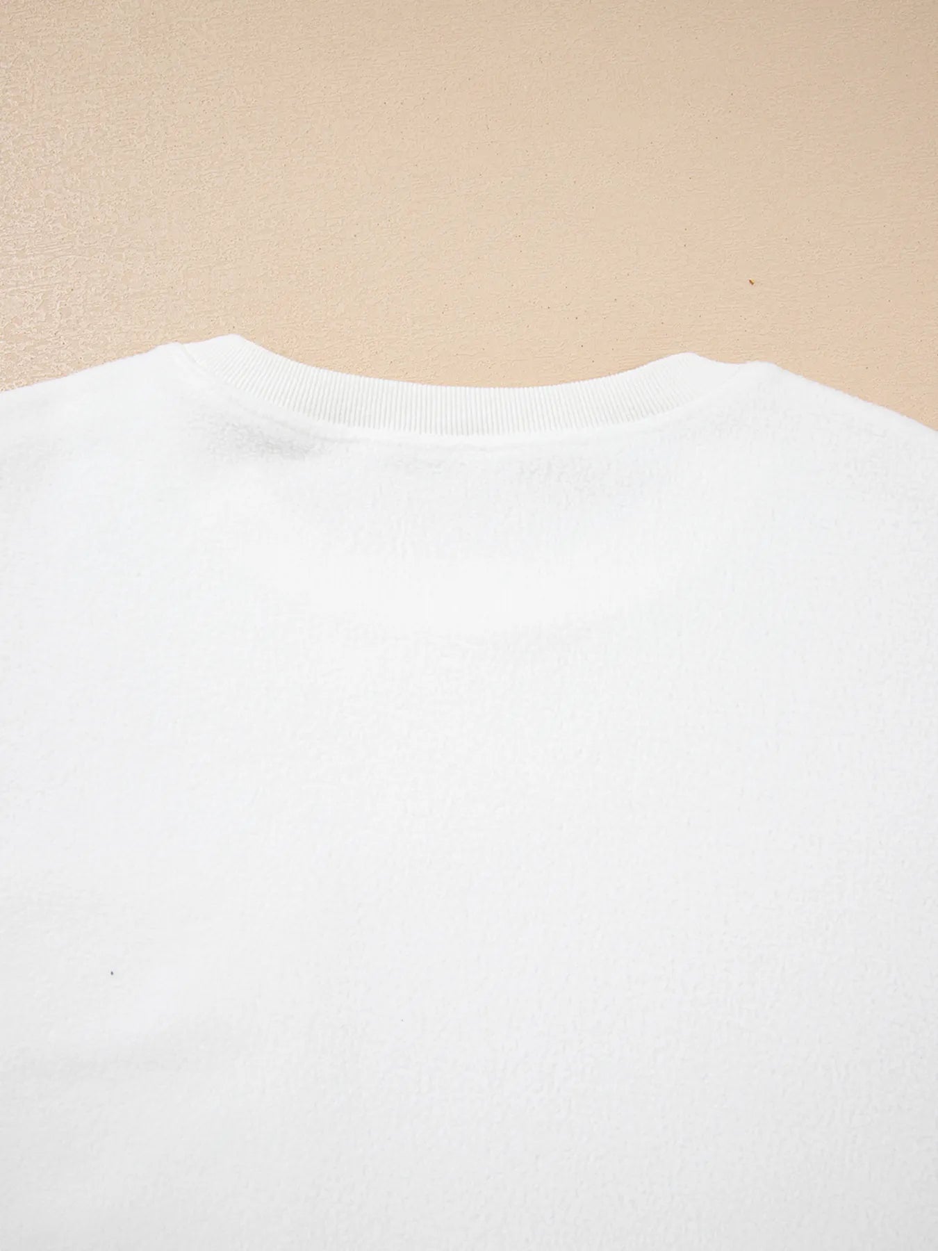 Soft and slightly stretchy top with exposed seam accents

