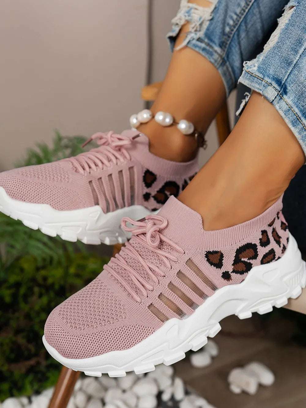 Lightweight leopard mesh sneakers displayed on clean backdrop

