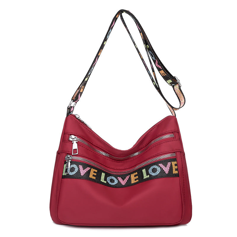 Stylish Red Oxford Cloth Crossbody Bag: Multi-Pocket Layout for Organized Travel