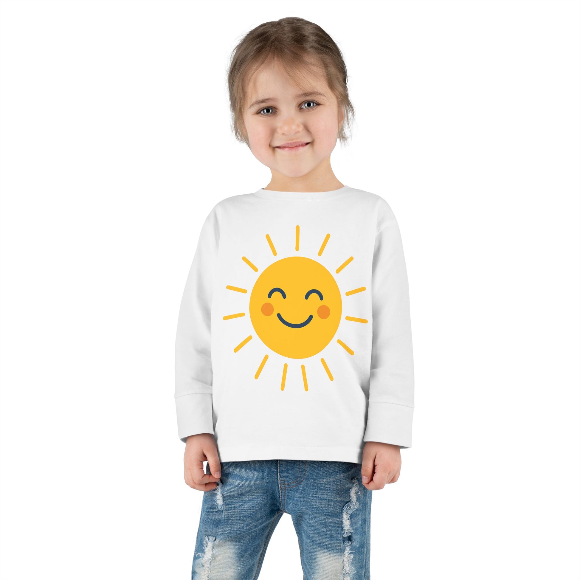 Toddler wearing Sunny Smile Toddler Long Sleeve Tee playing in the park, showcasing the cheerful sun graphic

