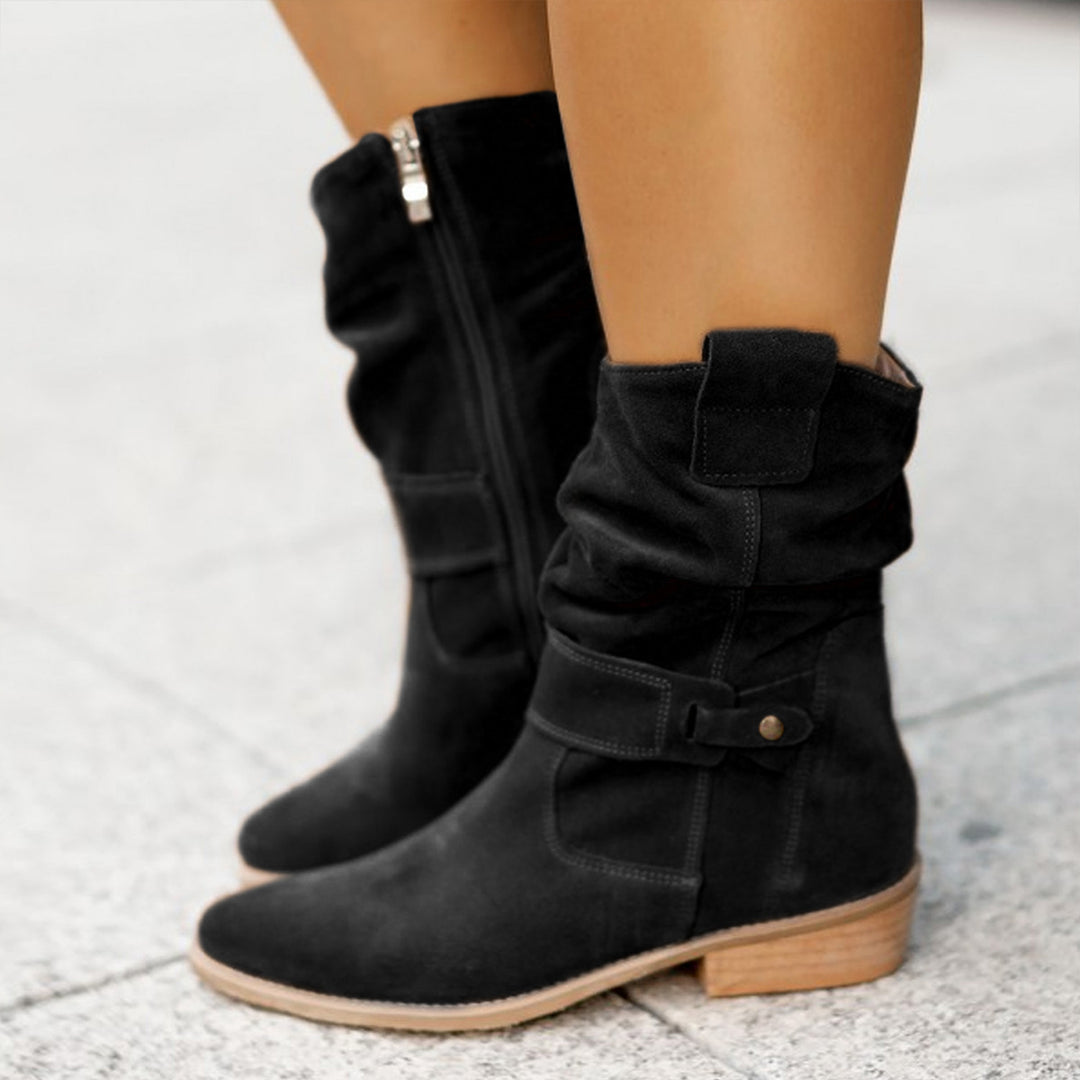 Winter boots styled with dark denim and leather jacket
