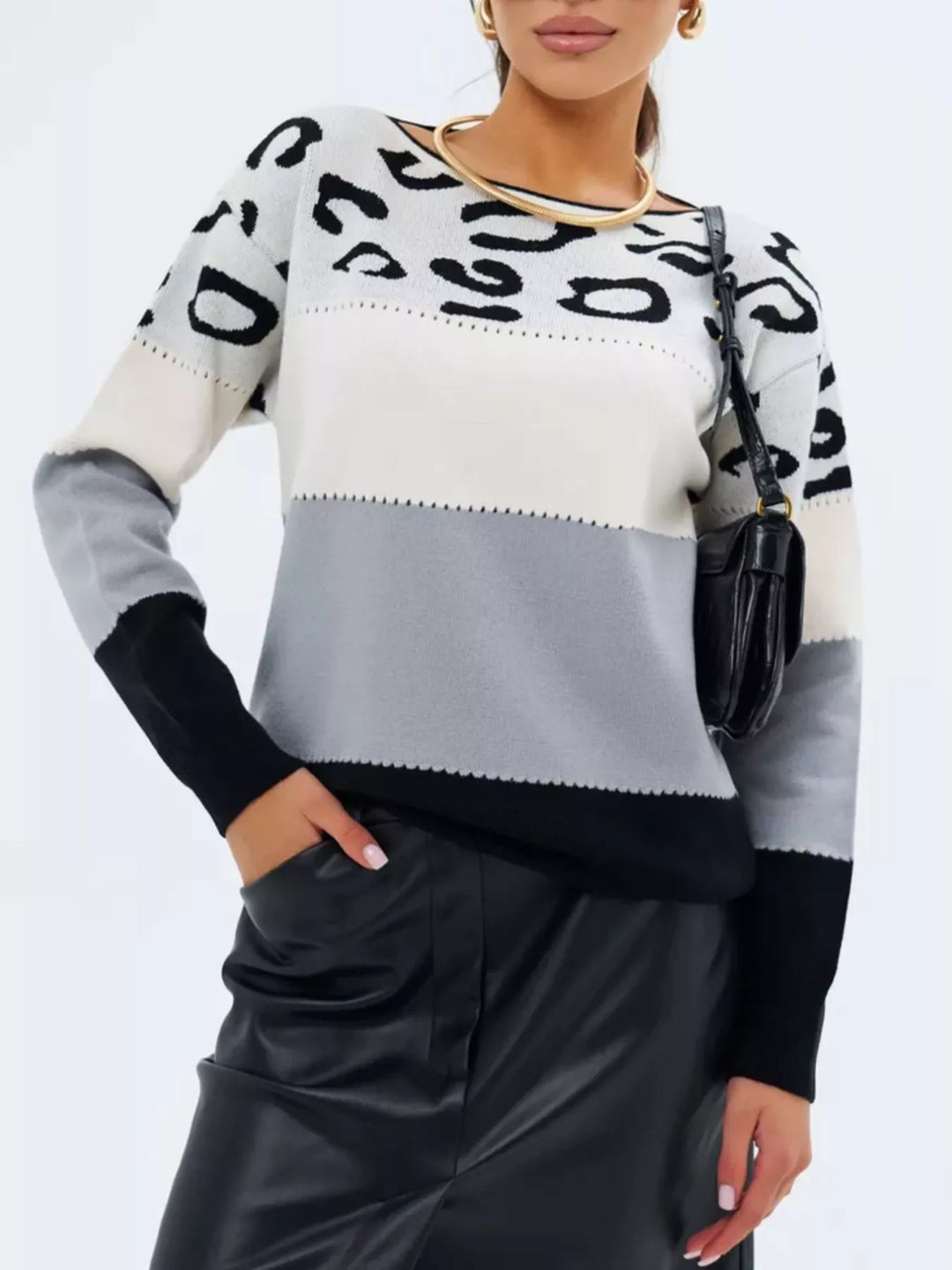 Woman in spotted pullover at coffee shop setting