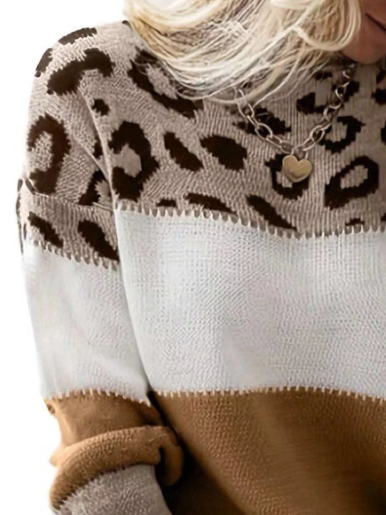 Woman layering leopard knit over white tee