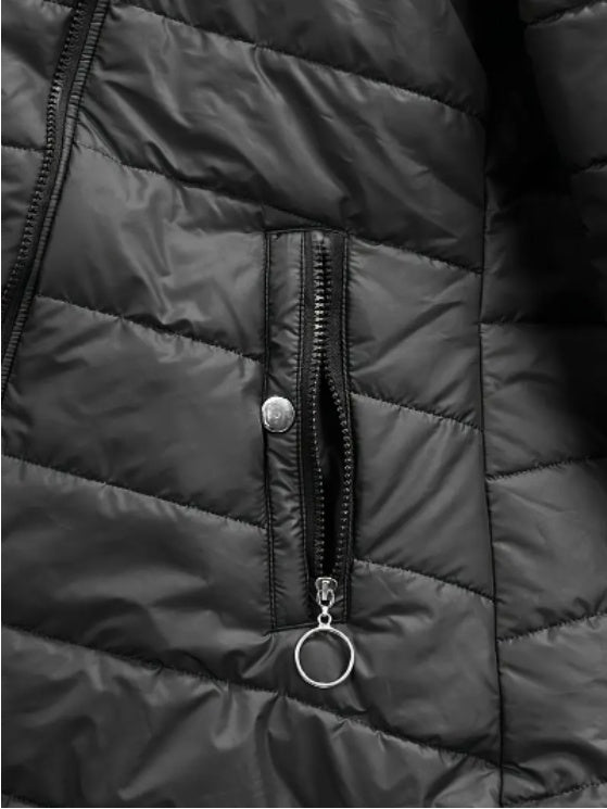 Woman walking in the city in a comfy, regular sleeve puffy jacket.

