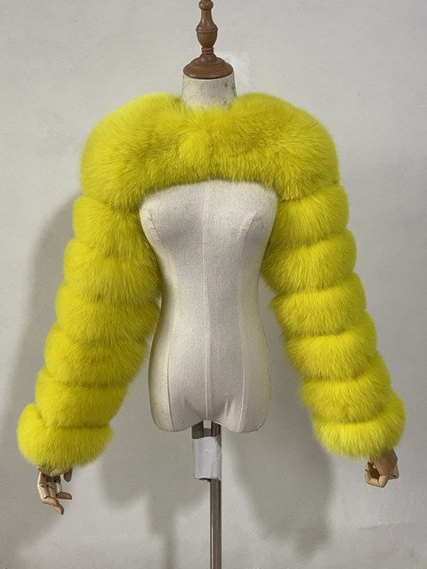 Faux fur shoulder bolero with segmented sleeves on dress form