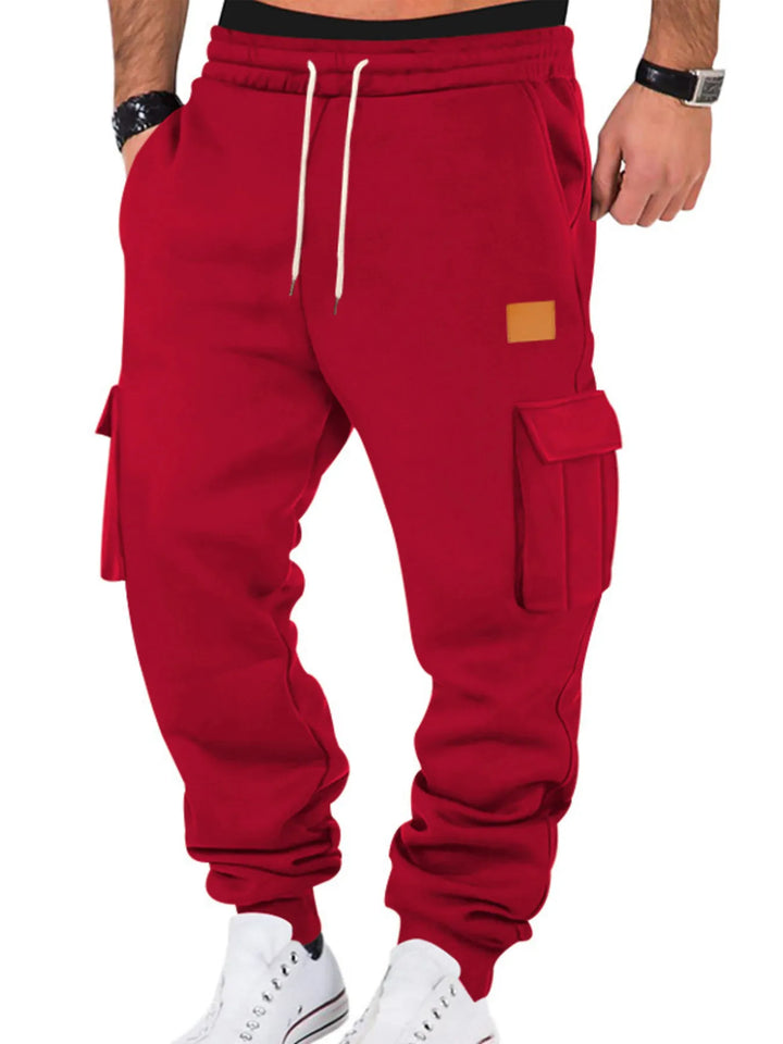 mens cargo jogger pants with pockets front view featuring drawstring closure and clean tapered jogger silhouette
