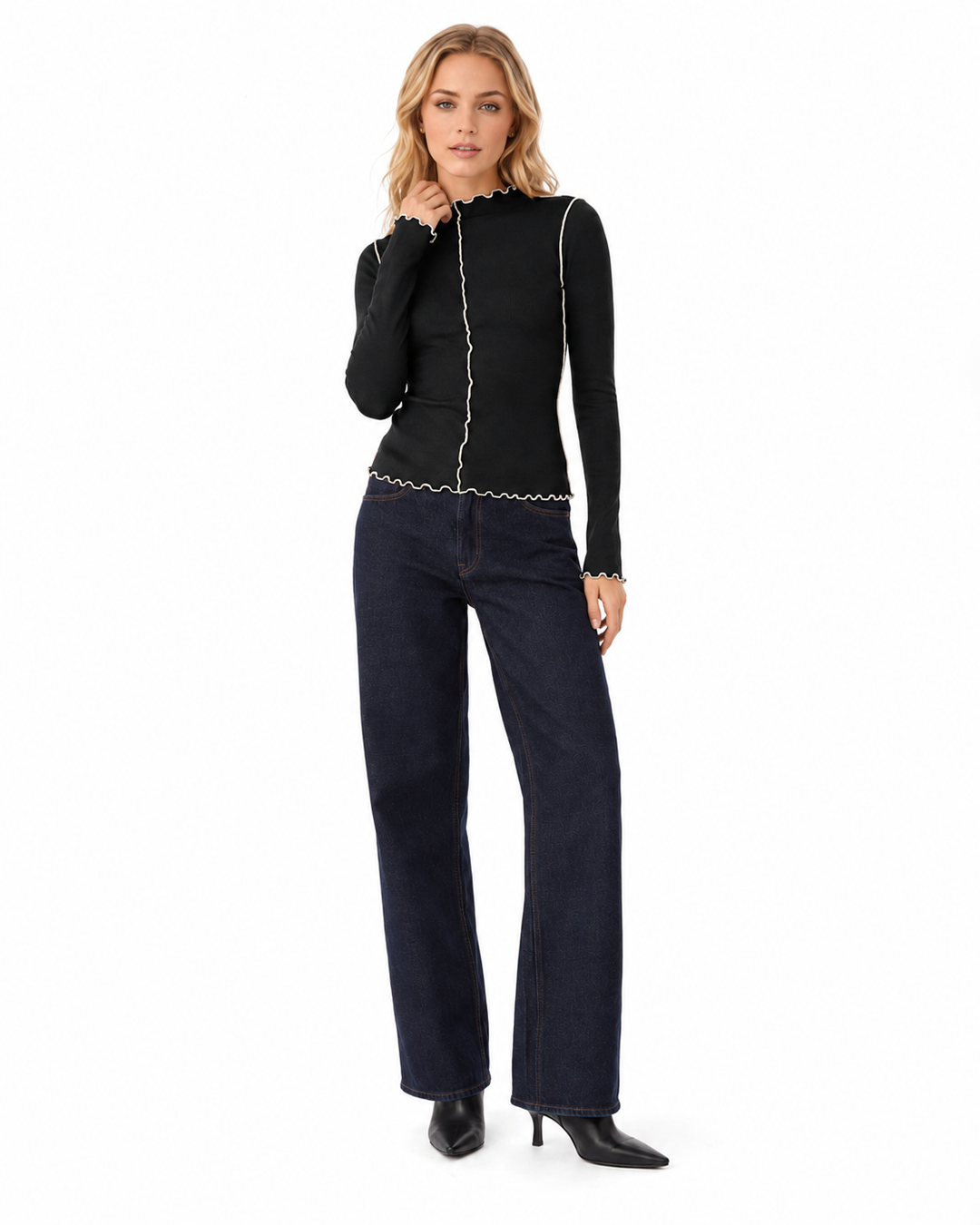 Detail view of contrast stitching and wavy lettuce trim on a women&