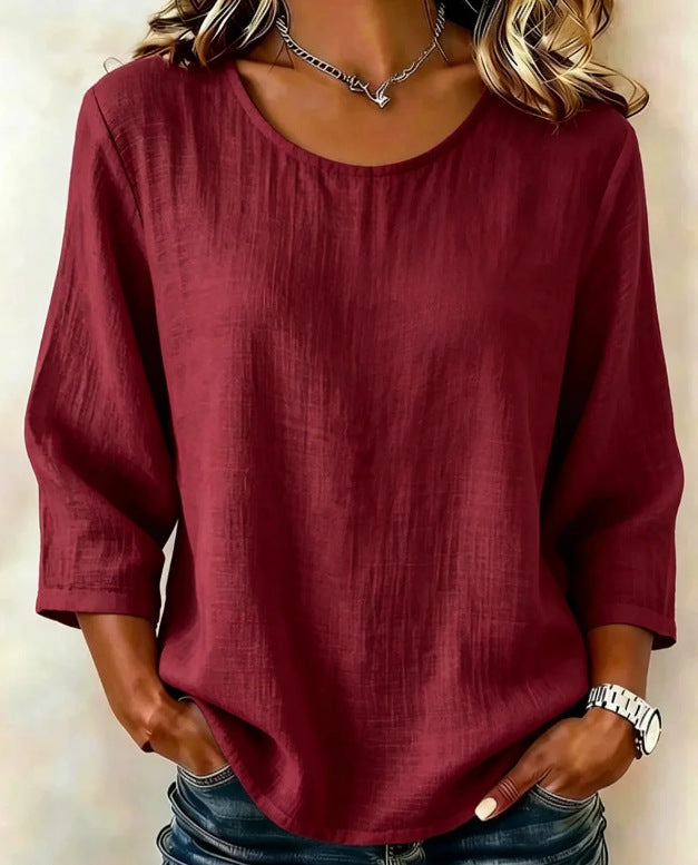 Product image showing solid-color casual top design and three-quarter sleeve length, displayed clearly for easier comparison.