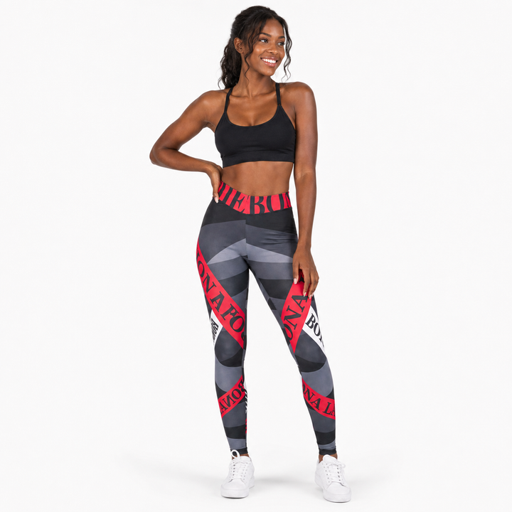 Printed yoga leggings with alphabet design in a lifestyle view, high waist styling and sizes S through XL for product review.