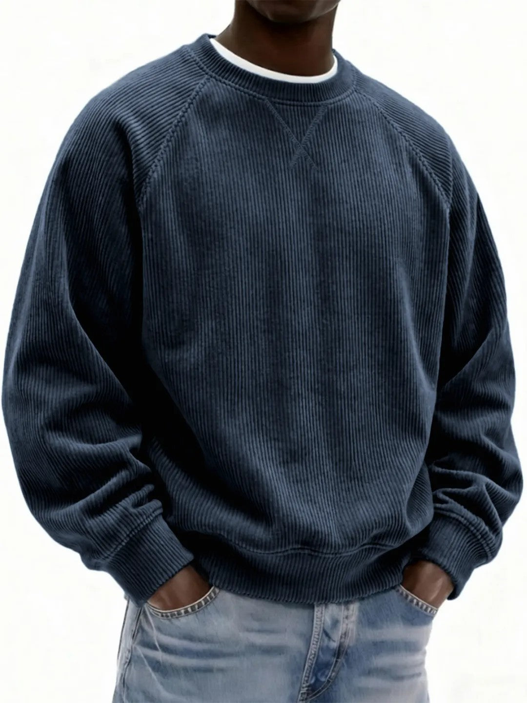 Person wearing a blue corduroy sweatshirt on a white background