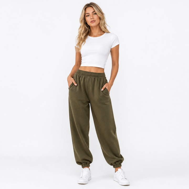 Minimal streetwear look featuring high waist joggers and a fitted sleeveless top