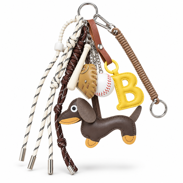 Baseball bag charm set with yellow B, dachshund, glove, ball, bat, cords and silver hardware