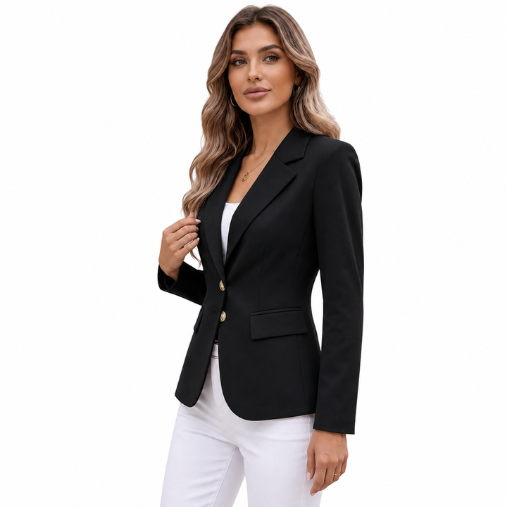 Black blazer side view on a female model, showing tailored waist, notch lapels, long sleeve profile and balanced proportions.