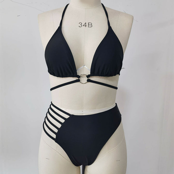 Black bikini front view on a supplier mannequin showing the halter neck, central ring, underbust ties and cutout side straps.