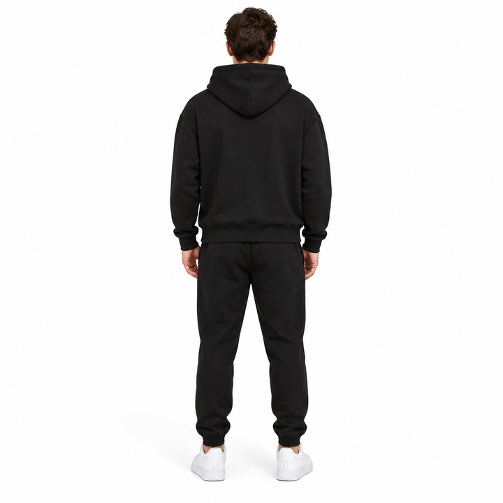 Black hoodie and sweatpants set shown from the back on a full-body model