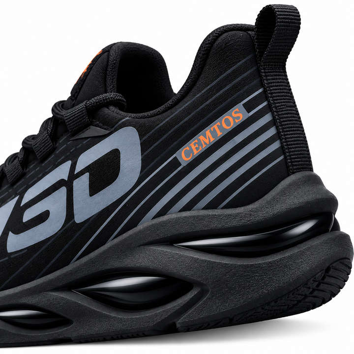 Black athletic-style shoe with orange accent, gray side graphic and molded black outsole