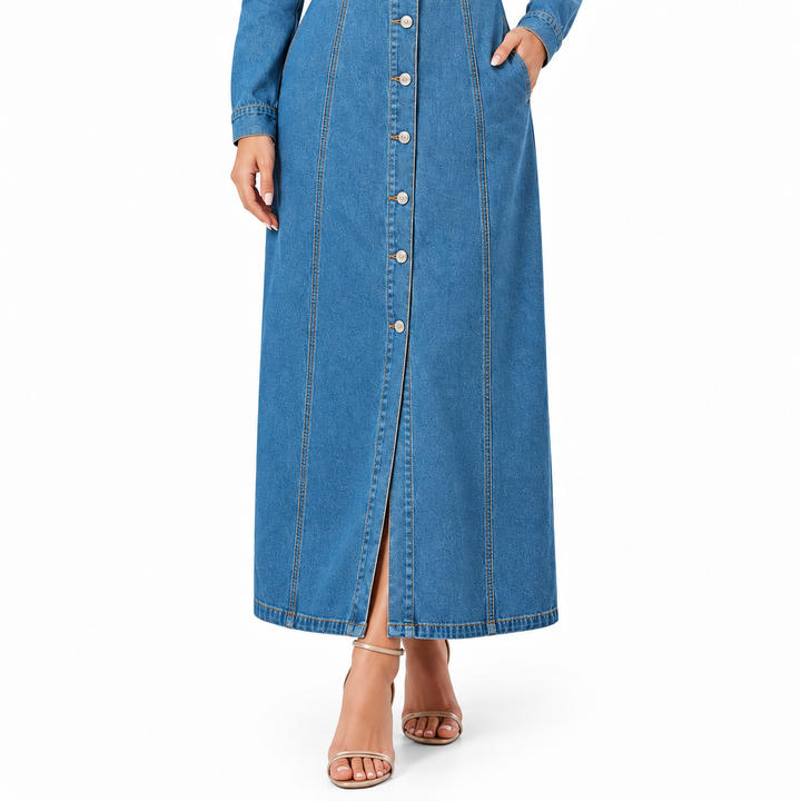 Blue denim dress lower-body detail showing button placket, vertical seams and long hem