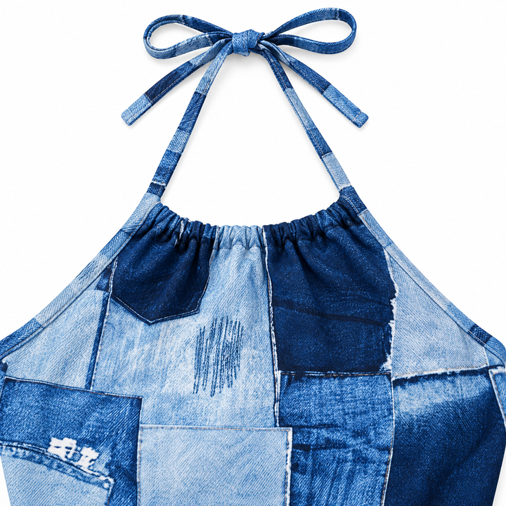 Close-up of the blue printed halter straps and gathered neckline detail on the dress.