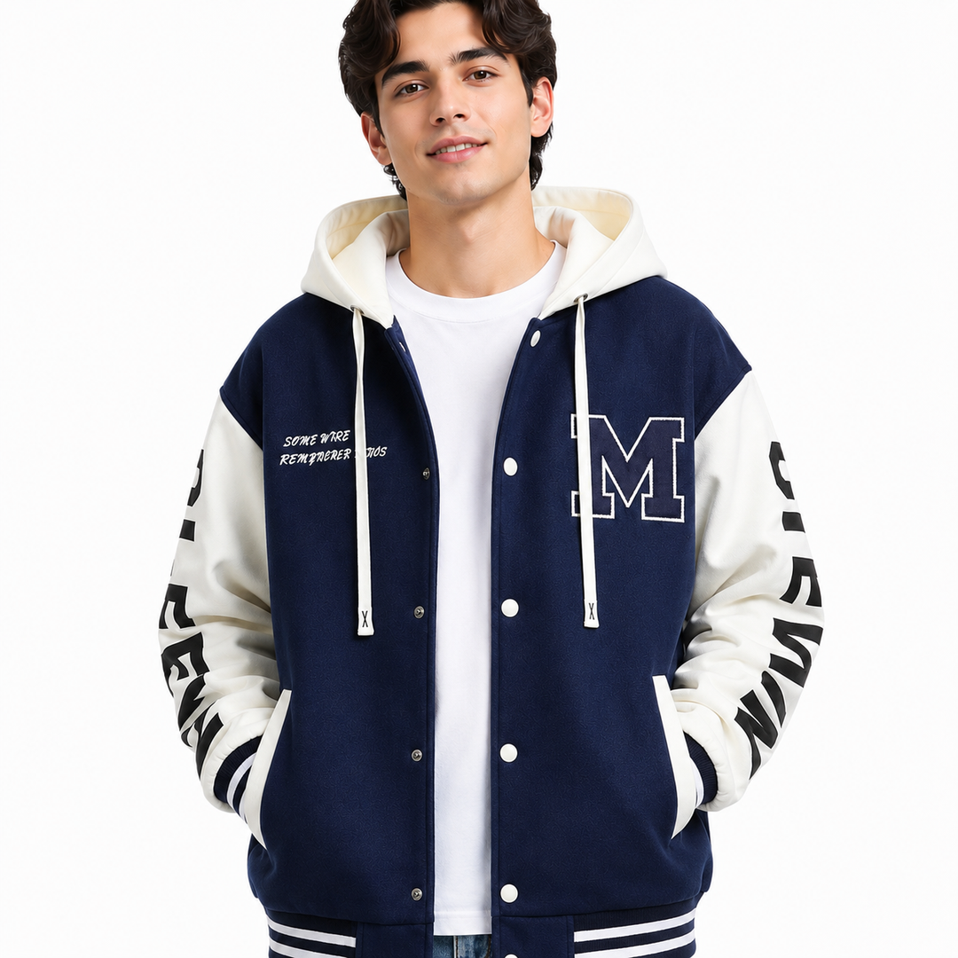 Navy and white colorblock hoodie jacket close-up on male model showing chest patch, hood, snap buttons and ribbed trim