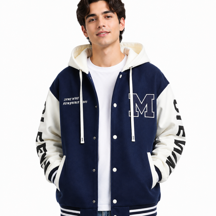Navy and white colorblock hoodie jacket close-up on male model showing chest patch, hood, snap buttons and ribbed trim