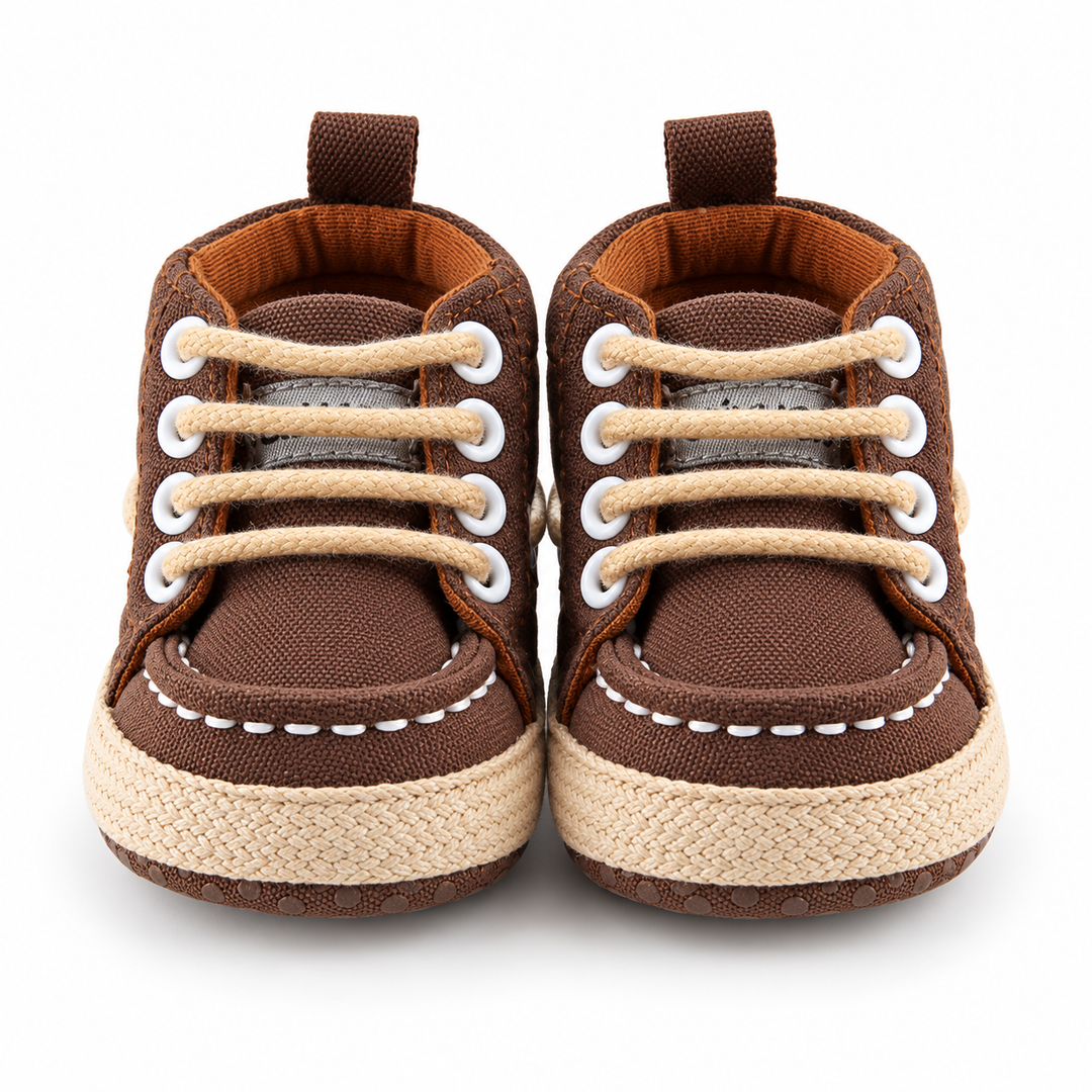 Brown baby canvas crib shoes front view with lace-up design
