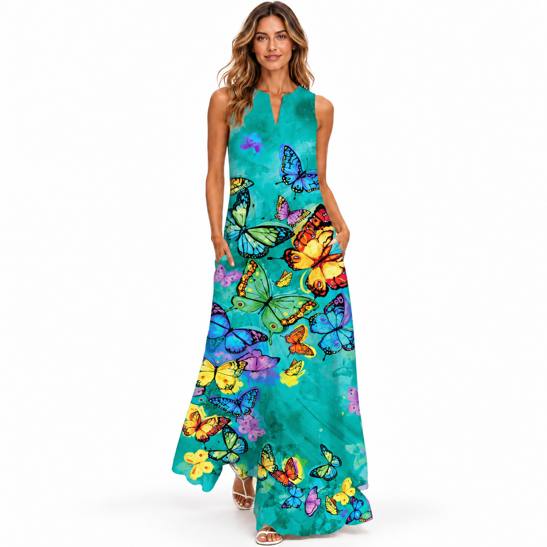 Turquoise butterfly print sleeveless maxi dress with pockets, full front studio view