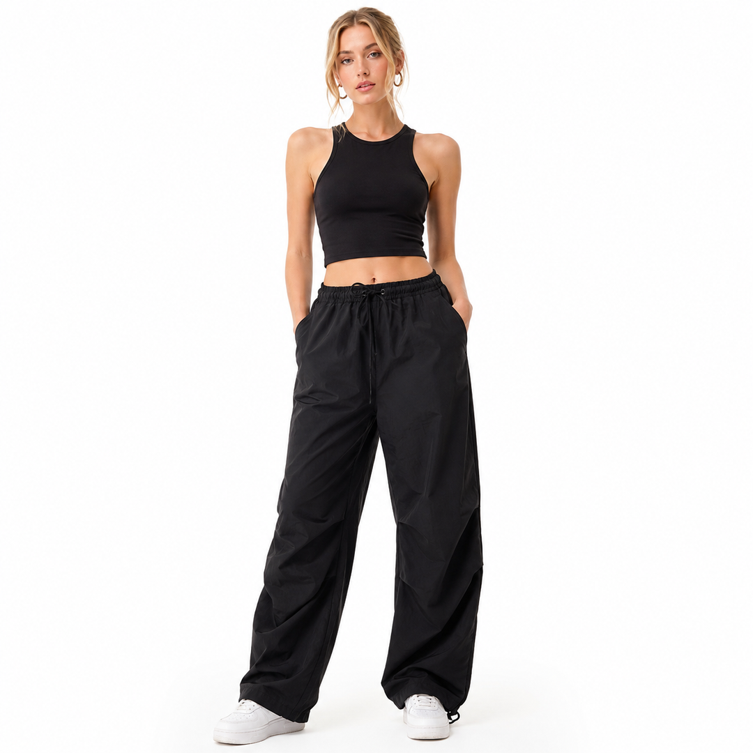 Black loose cargo pants for women with low-rise waist, practical pockets, thin fabric, and relaxed everyday styling for wear.