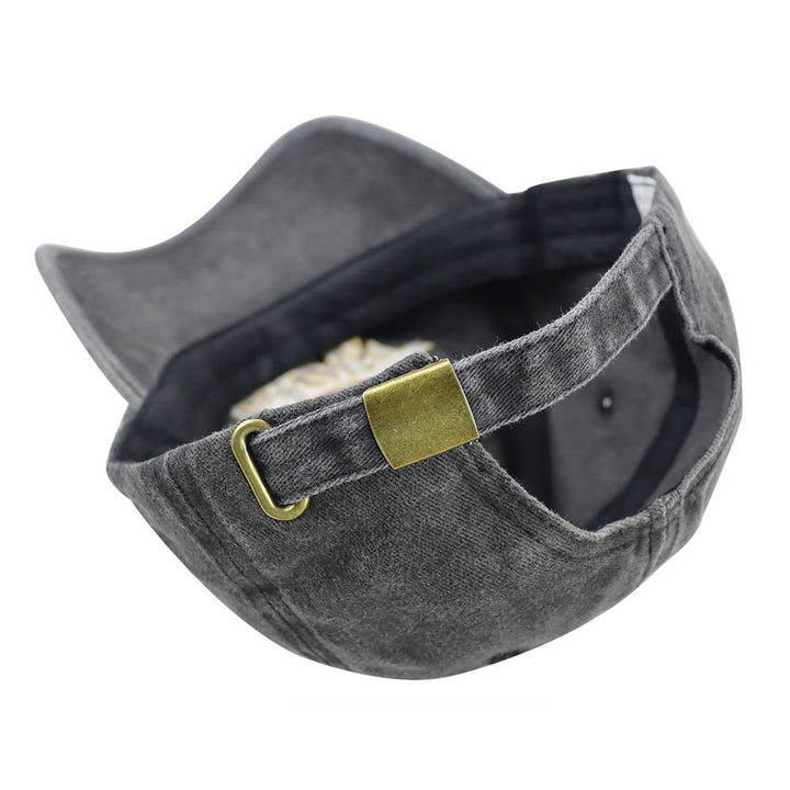Back view of metal snapback closure and adjustment strap on vintage washed grey cotton baseball cap