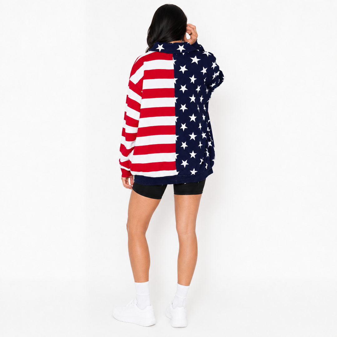 Model in USA flag sweatshirt showing roomy sleeves, longer length, and easy casual styling.
