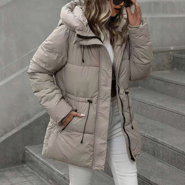 women’s mid-length hooded cotton coat pocket detail functional clean finish lifestyle shot