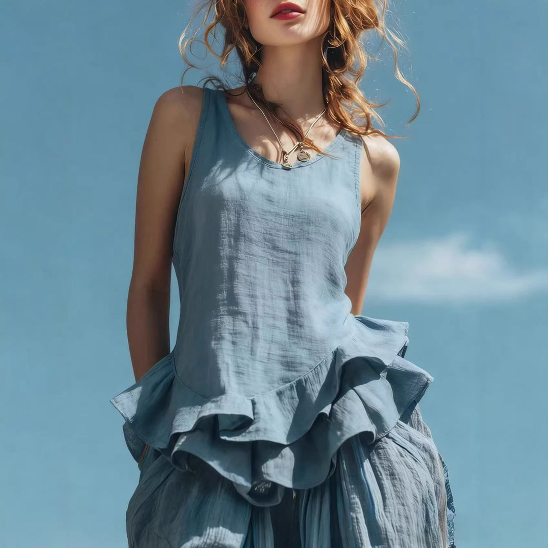 Summer blouse with ruffled hem paired with loose pants for vacation wear