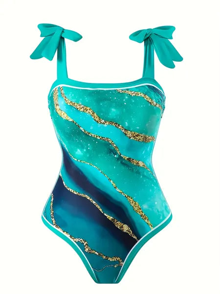 Close-up of premium swimsuit fabric with bold tropical print pattern texture

